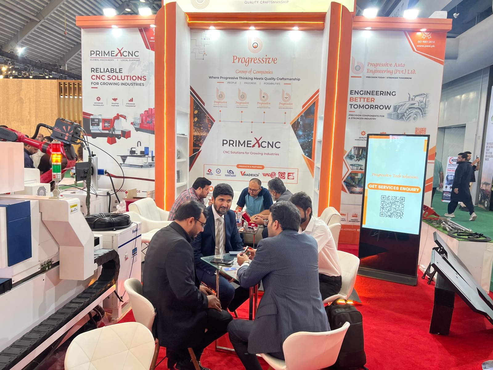 Visitors and professionals gathered at an exhibition booth