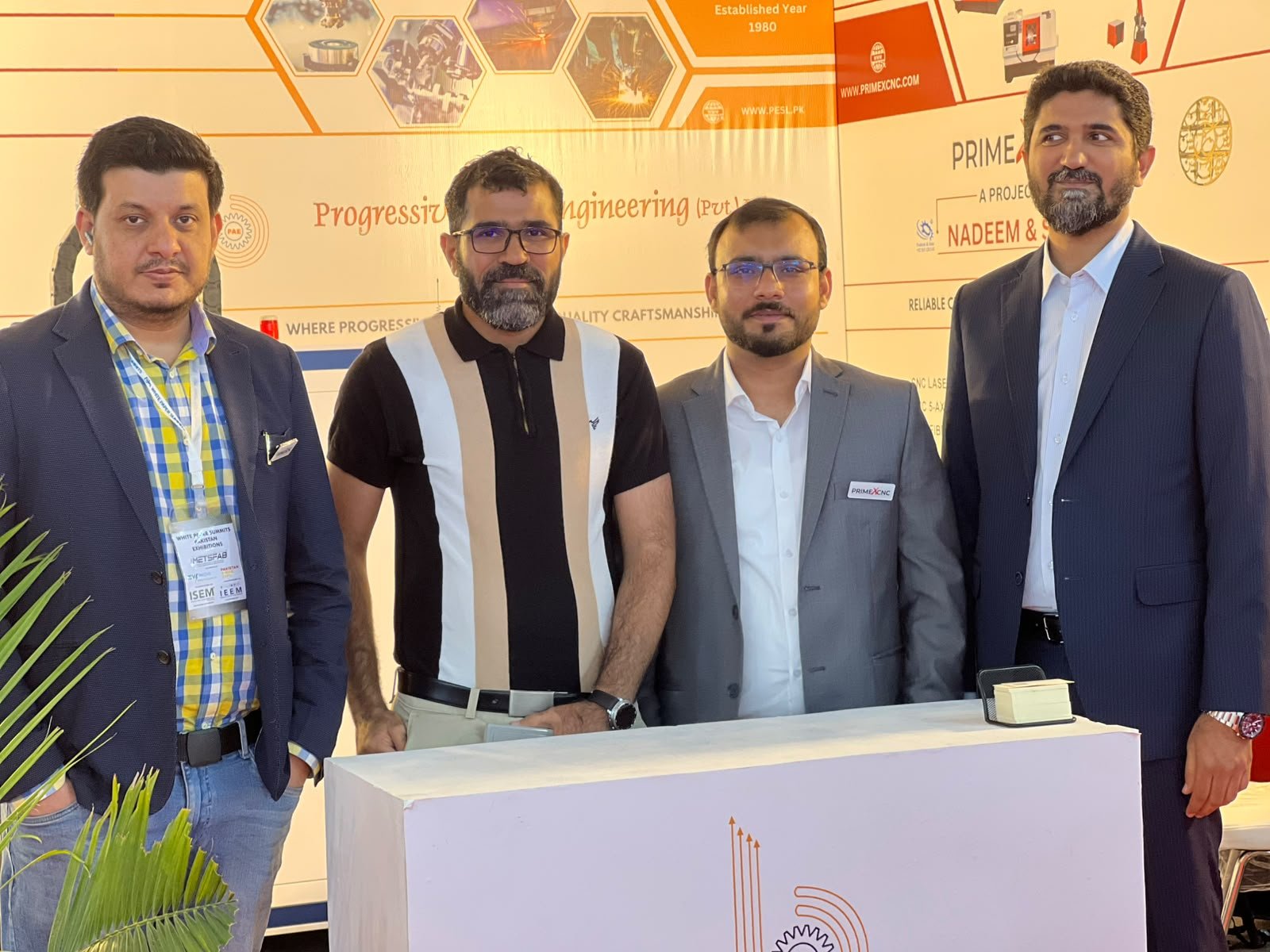 PrimeX CNC team members together at an industry exhibition